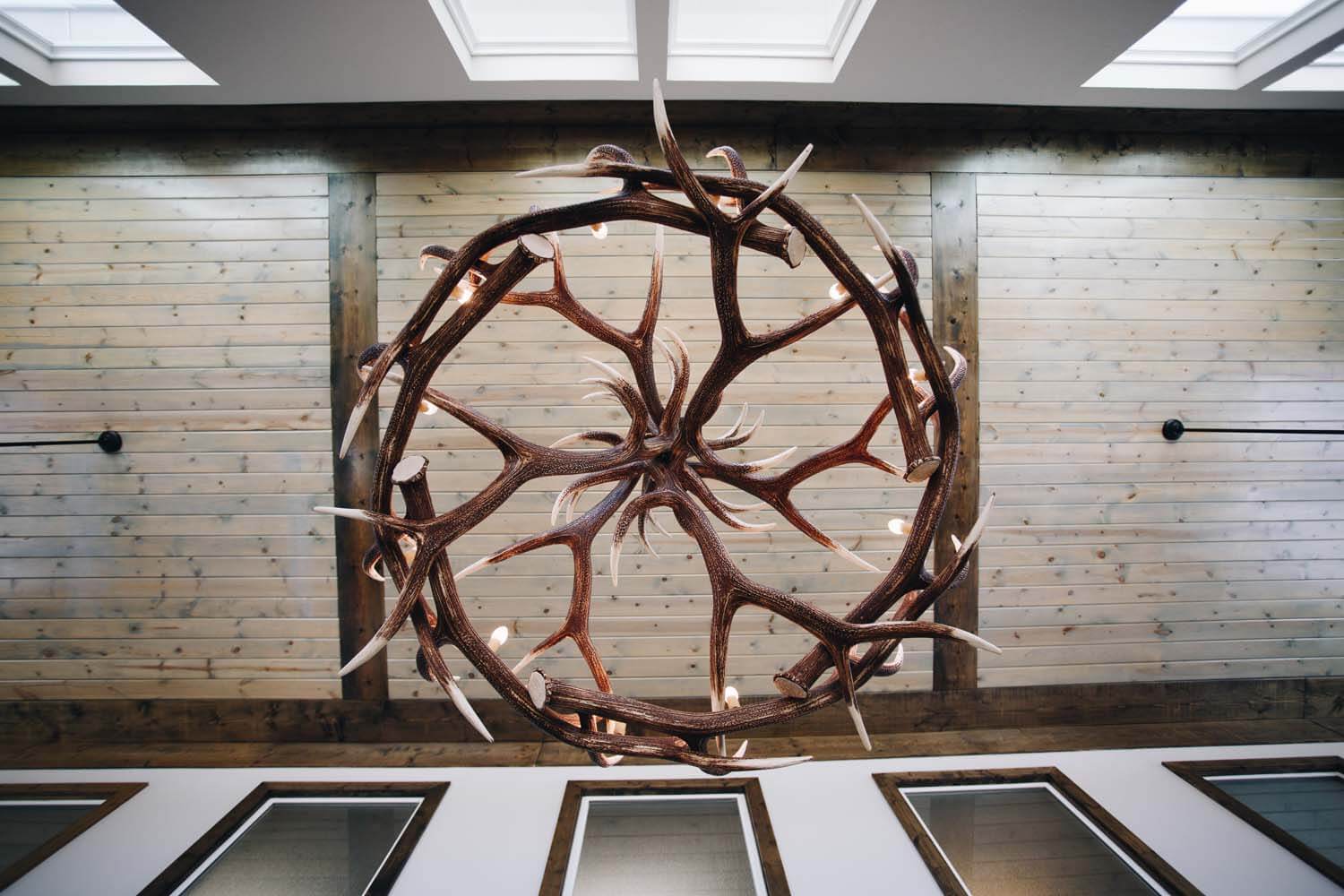 a picture of the antler chandelier inside the main office at creekside townhomes
