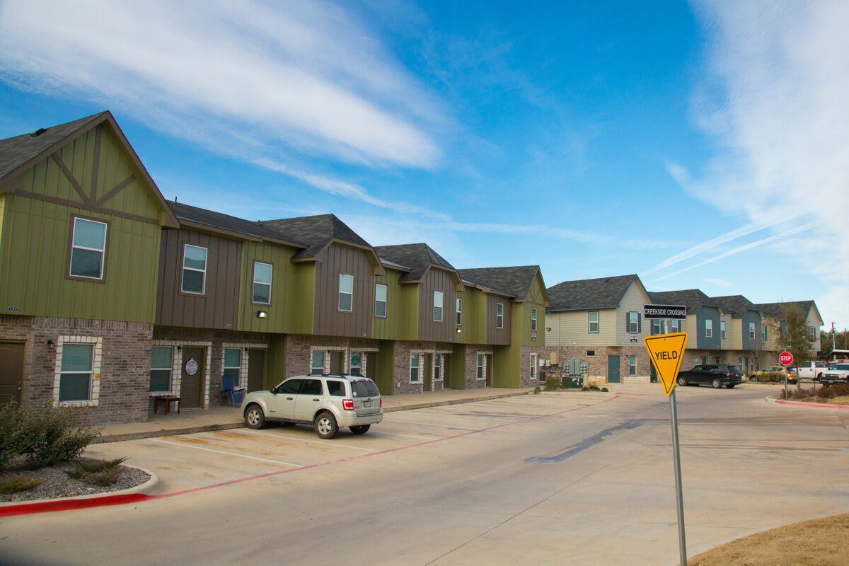 a view of the creekside townhomes from the street